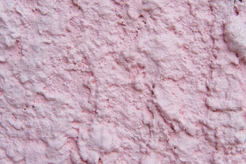 Old style vintage abstract pink grunge cement wall texture background.