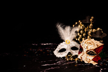 Venetian masks for carnival on a black background