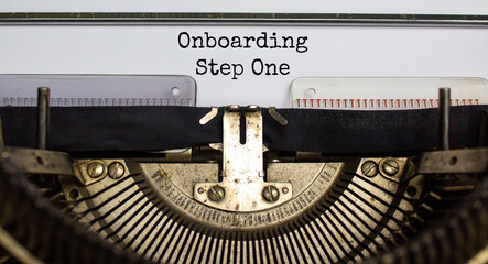 Onboarding step one symbol. Words 'onboarding step one' typed on retro typewriter. Business and onboarding step one concept.