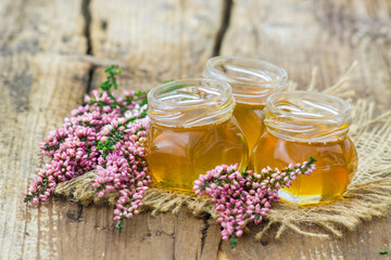 Obraz na płótnie Canvas herbal honey with heather flowers