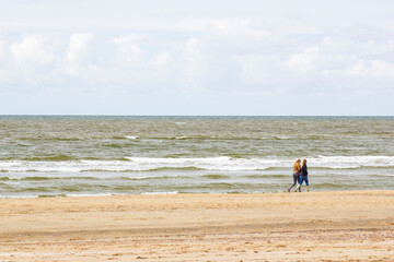 Fototapeta na wymiar Silhouettes on the beach in the Netherlands