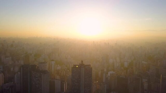 flight into the sun on City centre Of Sao Paulo, near republica at sunset