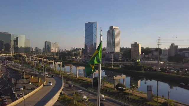 drone flight showing estaiada bridge in S&atilde;o Paulo during a sunset on a busy day