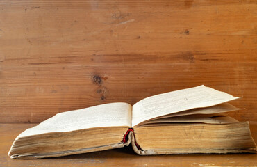 Revealling book rests upon wooden regiment