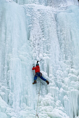 Ice climber on waterfall