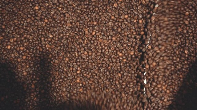 top view of roasted coffee beans in machine