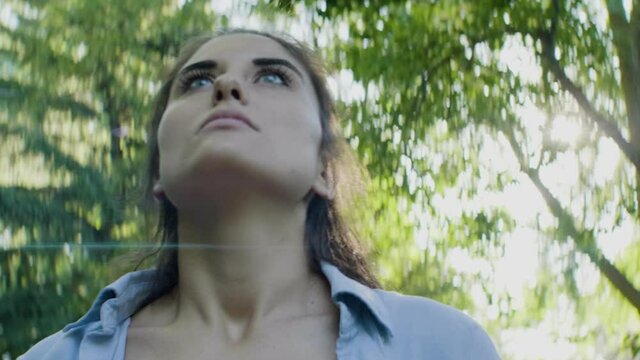 Girl looking around a forest