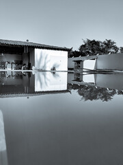 reflection of a house in the water