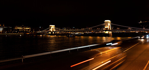 View of the Szechenyi Bridge at night in Budapest, Hungary.