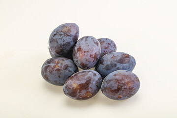 Purple sweet ripe plum heap