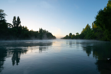 Morning mist rises from Clutha River Cromwell