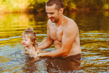 Fototapeta premium the father with the child in the water