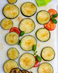 Eggplants cut into slices and prepared for baking