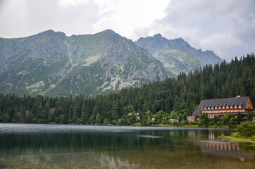 Fototapeta premium View to Lake Popradske pleso 1494m with mountain hotel in High Tatras, Slovakia. Popular travel and hiking destination 