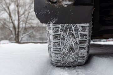 winter tires on snow and mud on the wheel