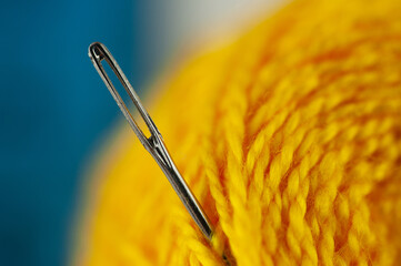 the eye of a needle in a ball of thread