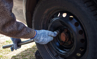 replacement of winter tires on the grass