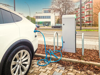 electric car while charging in a parking lot