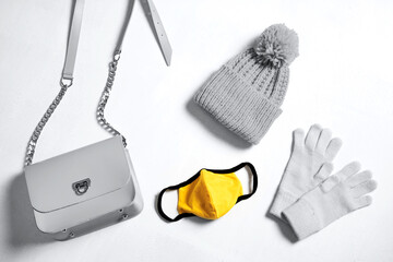 Colors of year 2021 - Gray and Yellow. Multiusage face mask and other objects that man needs to go outside.