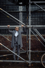 Obraz na płótnie Canvas Full length body size photo ofcurious young man in stylish outfit wearing plaid suit grey coat scarf 