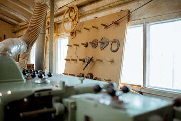 Old woodworking machine with cutters at the workshop