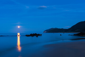 Fototapeta premium The Moon in Trengandin beach, Noja, Marismas de Santoña, Noja y Joyel Natural Park, Cantabrian Sea, Cantabria, Spain, Europe