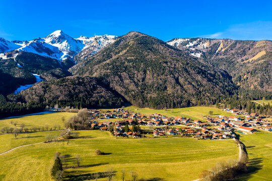 Germany, Bavaria, Schleching, Helicopter view of alpine town in summer