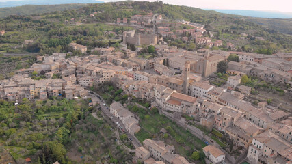 Fototapeta na wymiar amazing italian town Montalcino in mountains in summer day, aerial view, picturesque old living houses