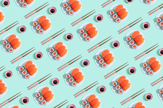 Pattern of plates of sushi against green background