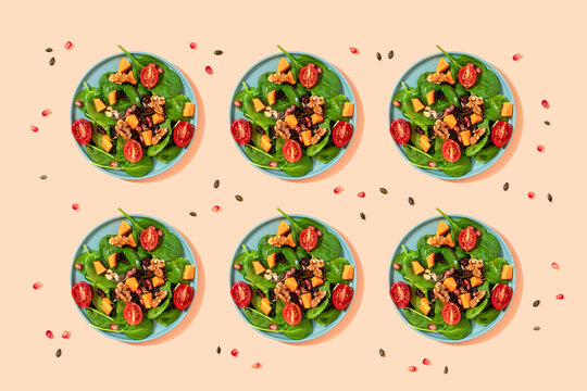 Pattern of plates of fresh ready-to-eat vegan salad