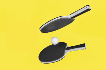 Ultimate Gray ping pong rackets on Illuminating Yellow background