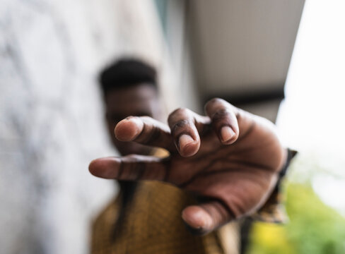 Man gesturing while standing outdoors