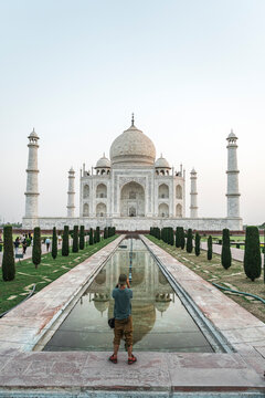 Young male tourist admiring Taj Mahal, Agra, Uttar Pradesh, India