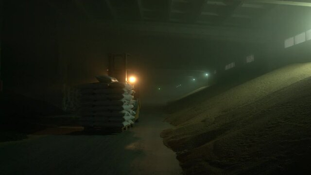 Forklift in grain warehouse