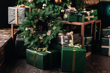 Fototapeta na wymiar beautiful green Christmas decorations and gifts under the Christmas tree 
