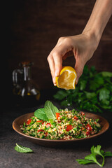 Quinoa salad with parsley, cucumber and cherry tomatoes. Tabbouleh Traditional middle eastern or...