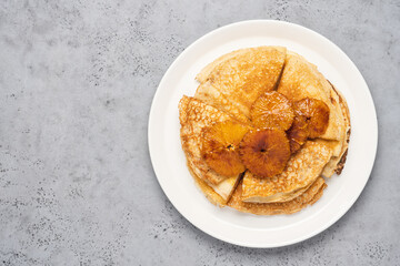 Traditional French thin pancakes crêpe suzette with orange sauce. Morning breakfast dessert