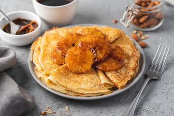 Traditional French thin pancakes crêpe suzette with orange sauce. Morning breakfast dessert