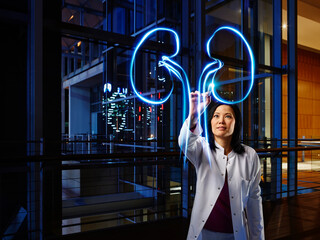 Mature female nephrologist analyzing kidney in laboratory at hospital