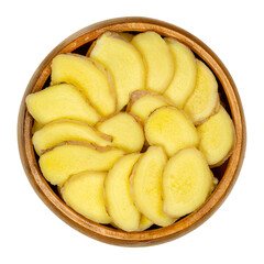 Fresh ginger slices in a wooden bowl. Rhizomes of Zingiber officinale, cut into sections, used as a fragrant spice and as a folk medicine. Close-up, from above, isolated over white, macro food photo.
