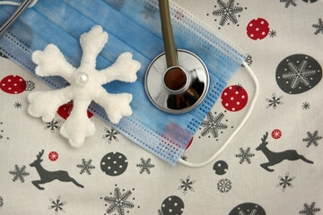 Happy New Year with medical mask, snowflake and stethoscope