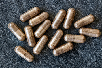 close-up of licorice (DGL) capsules. dietary concept. dietary supplement topview.