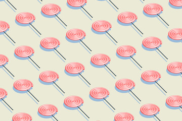 Candy pattern, pink lollipop with pale yellow background, raster illustration.