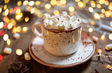 Cup of tasty hot cocoa, on wooden table, on shiny background