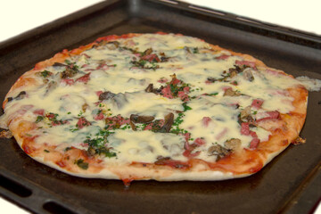 Pizza with mozzarella, fried mushrooms, sausage and parsley