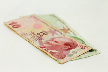 Ten turkish lira and twenty turkish lira paper currency laying isolated on the white