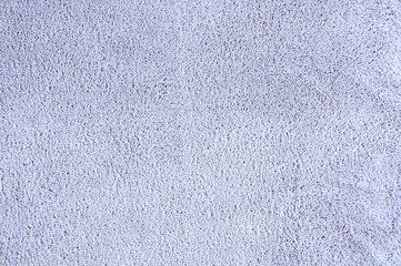 Texture of gray terry bedspread on  bed. Plaid close-up.