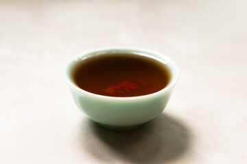 Ceramic chinese tea cup with fish on the bottom.