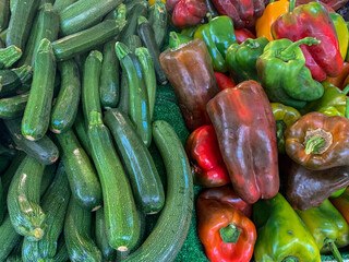 Zucchini and bell pepper on the market counter
