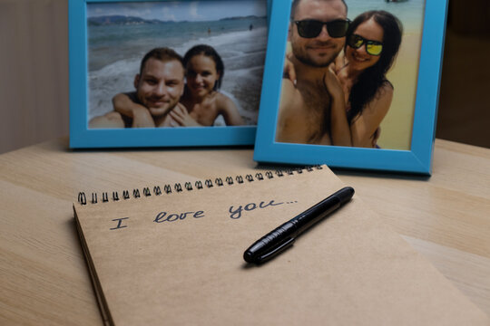 Love letter behind photos in frames with happy smiling travelling couple of young people.